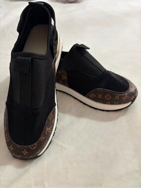 SL Fashions, Ladies Black Slip-On Sneakers with Brown Monogram Accent. NEW. S 7